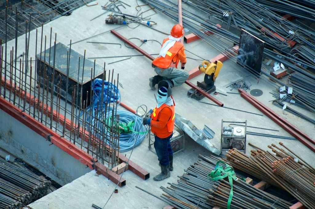 Construction crew reviewing plans and procedures on a jobsite