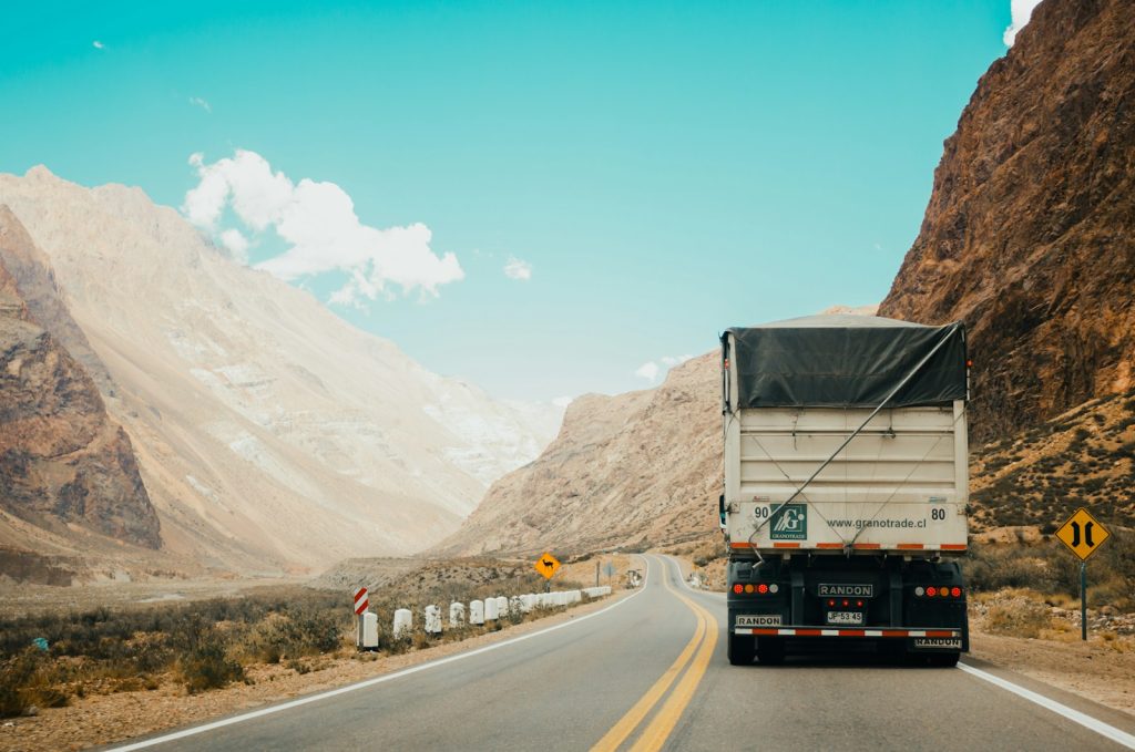 Commercial fleet trucks on the road representing driver safety training